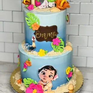 a three tiered cake decorated with a moan theme