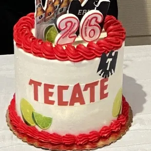 a person cutting a cake with scissors