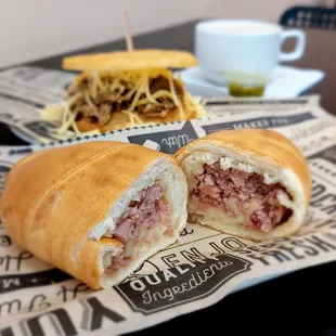 Hamrolls with shredded beef arepa in the background