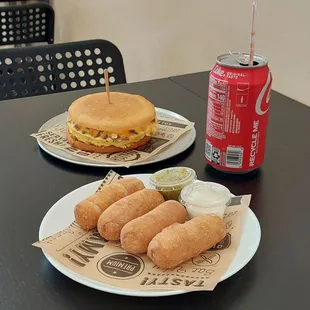 Egg &amp; Chorizo Arepa next to irresistible tequeños de queso!