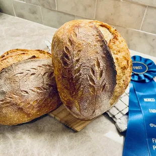 two sourdoughs with a blue ribbon