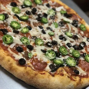 a pepperoni and jalapeno pizza