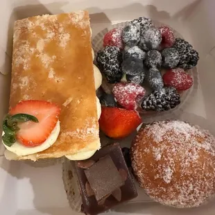 a variety of pastries in a box