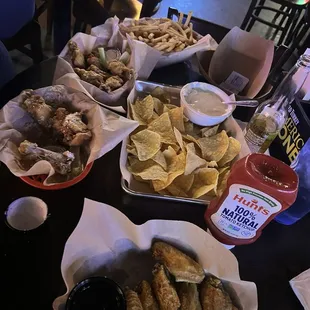 Wings fries and queso and chips