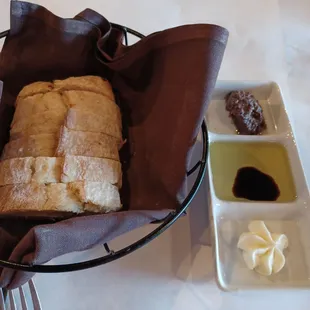 Bread with flavored butter, balsamic &amp; oil and tapenade