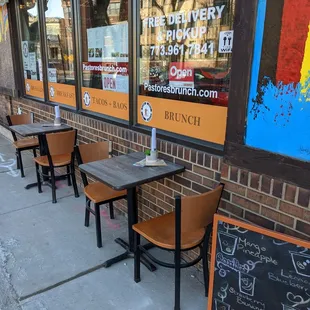 Outdoor dining tables on the side of the restaurant