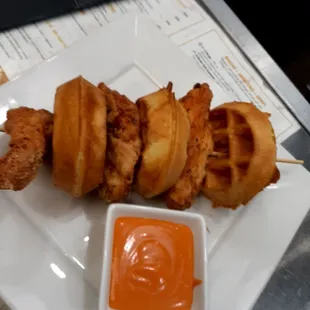 Chicken tenders  and mini  waffles buffalo  sauce