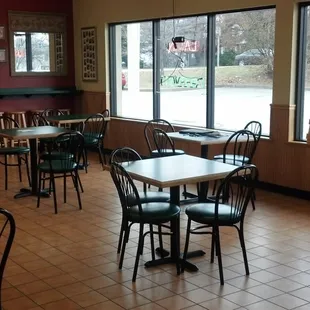 a restaurant with tables and chairs