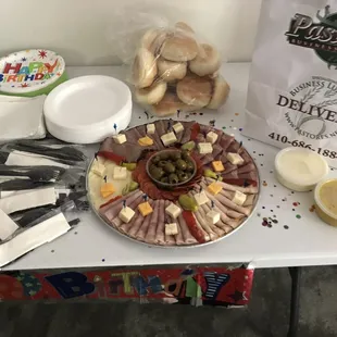 Regular party platter came with rolls, plates napkins plates.