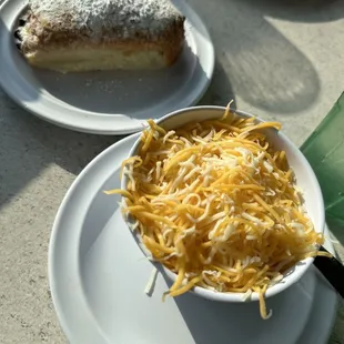 Chocolate croissant (pain au chocolate) and cup of cheese grits