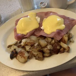 Eggs Benedict with home fries!