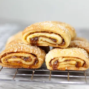 ows a stack of pastries on a cooling rack