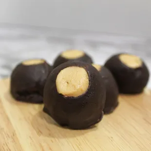 ows chocolate covered pastries on a cutting board