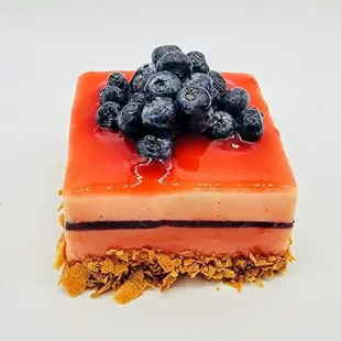 a piece of dessert with blueberries on top