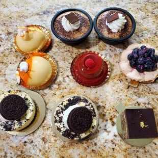 Mango mousse, cappuccino mousse cup, forest berry volcano, blueberry almond dacquoise, Oreo cheesecake, opera