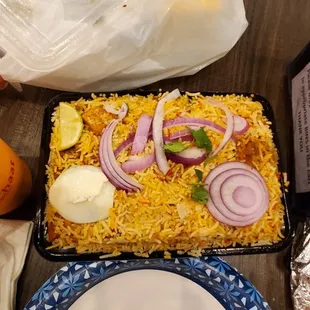 Tons of rice and 5 pieces of chicken in my biryani