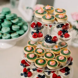 a display of cupcakes and cookies