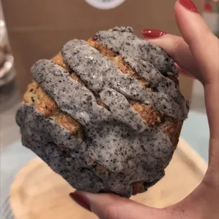a hand holding a piece of bread