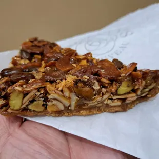 Florentine Cookie is delicious. It seems more like a dessert bar than a cookie.