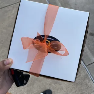 a hot dog wrapped in a gift box