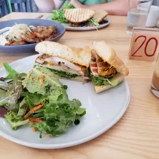 Front: harvest chicken sandwich  Back: steak gochujang sandwich