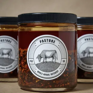 three jars of food on a table