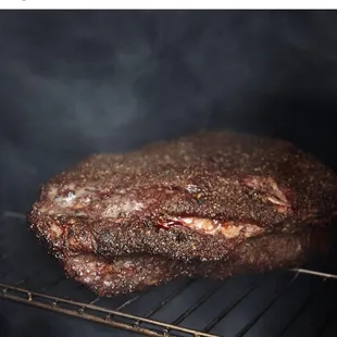 a beef roasting in the oven