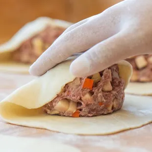 The Beef Pasty. Premium beef, potatoes, carrots, and onions, mixed with our bled of secret spices.