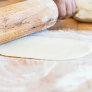 Our dough is made fresh daily, rolled, and baked to perfect.