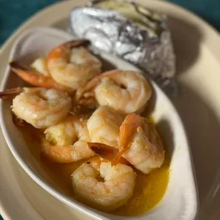 a plate of shrimp and potatoes