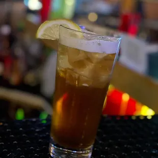 a drink with a slice of lemon