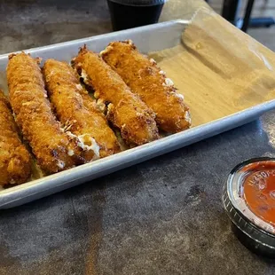MOZZARELLA STICKS with Marinara Sauce. The happy hour size is 3 sticks which is still filling enough when ordered with a meal