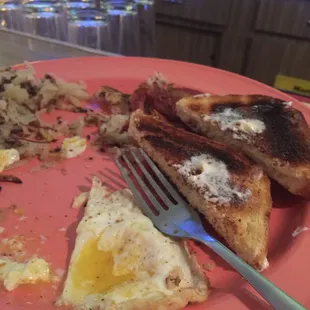My husbands b-fast with burnt toast and he got the hash browns and bacon. He didn&apos;t like