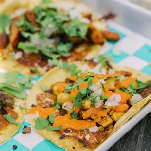 two tacos on a tray