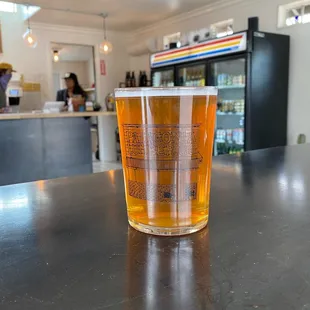 a pint of beer on a table