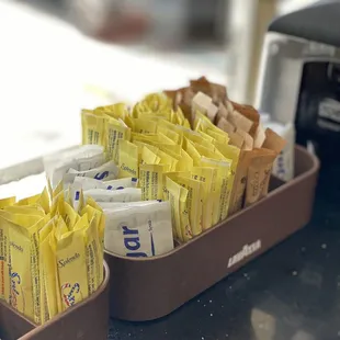 two trays of coffee packets