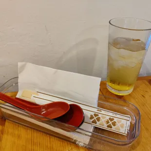 Utensils, napkins, and complimentary iced tea