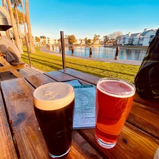 two beers on a picnic table