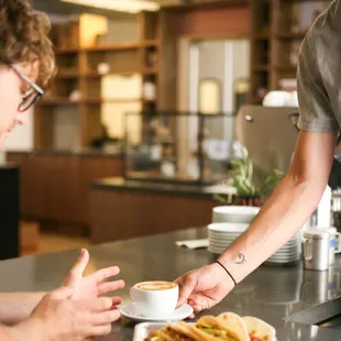 a man serving a plate of food