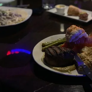 Surf and turf + stroganoff in the background.