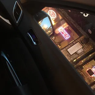 a view of a restaurant through a car window