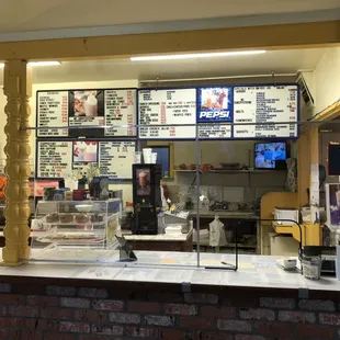 a restaurant counter with menus