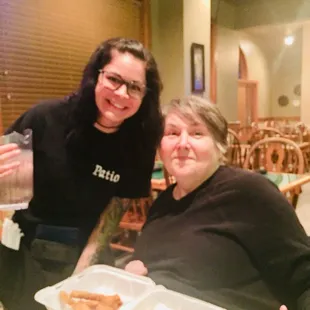 This is that sweetheart waitress I've ever been interactive with that's her to the left of me and I am just so happy to have known her.