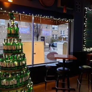 a christmas tree made out of beer bottles