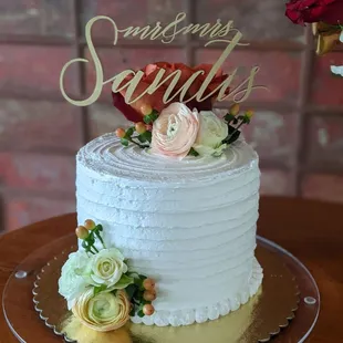 a wedding cake with flowers