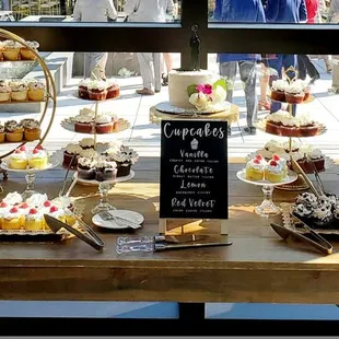 a display of cupcakes and pastries