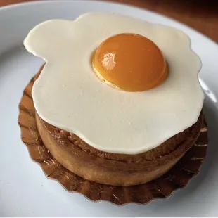 an egg on top of a pastry
