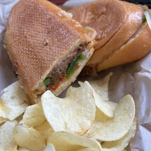 Carnitas Sandwich $11.29. Shredded beef, red peppers, onions, mayo, Monterrey Jack/cheddar on Italian with chips.