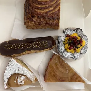 From the top, clockwise, Galette De Rois, Fruit (Berry) Tart, French apple tartes, Pear tart, Chocolate Eclair