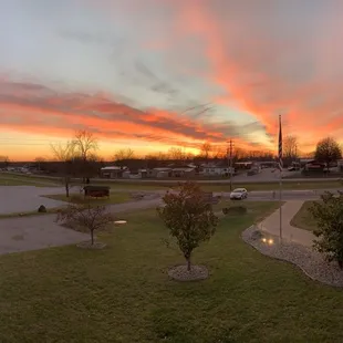 a sunset over a parking lot